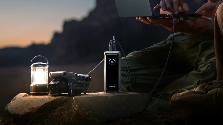 An Anker Prime Power Bank 26,250 mAh power bank next to a rechargeable lamp