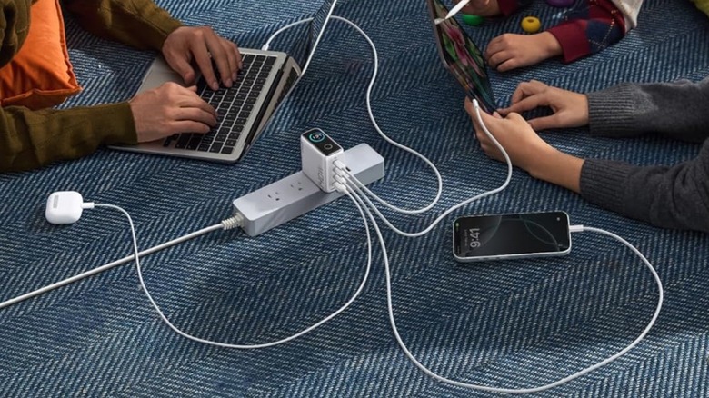 Several products charging on an Anker charger