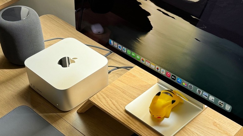 A table with a Mac Studio, Studio Display, and HomePod