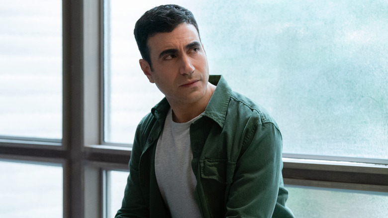 Louis (Brett Goldstein) frowning in 