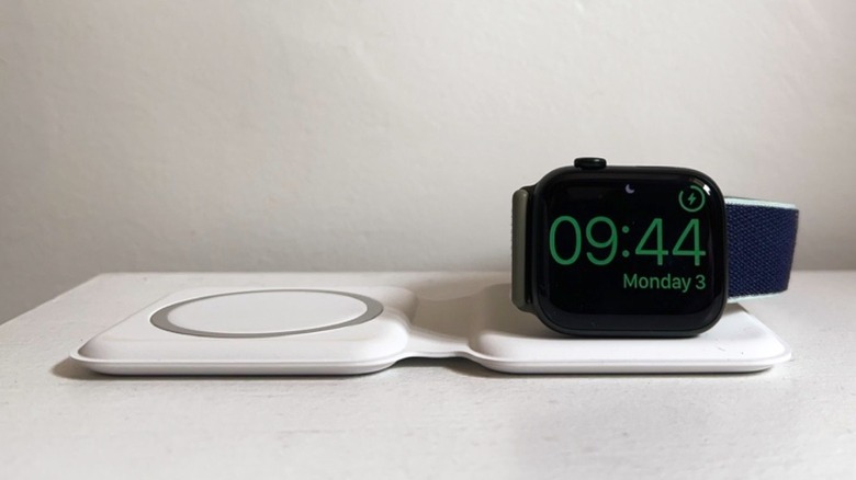 An Apple Watch charging on a MagSafe Duo accessory