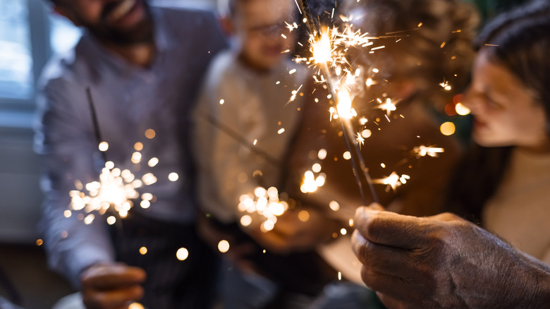 People holding sparklers on the New Year
