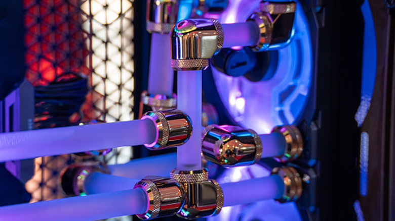 Custom liquid cooling tubes and fittings inside an RGB-lit gaming PC.
