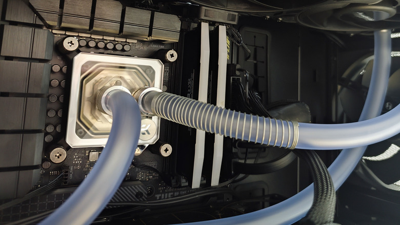 A custom liquid-cooled PC with clear tubes connected to the CPU block.