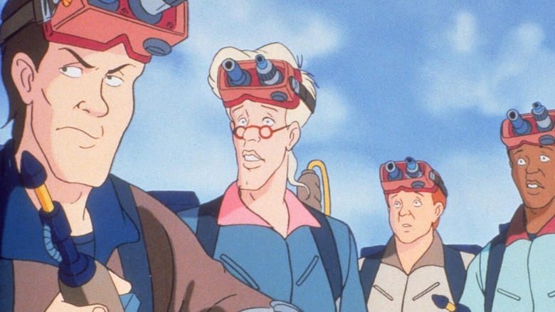 The Real Ghostbusters stood together wearing goggles