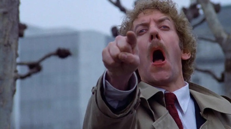 Donald Sutherland as Matthew Bennell, seen pointing in "Invasion of the Body Snatchers."
