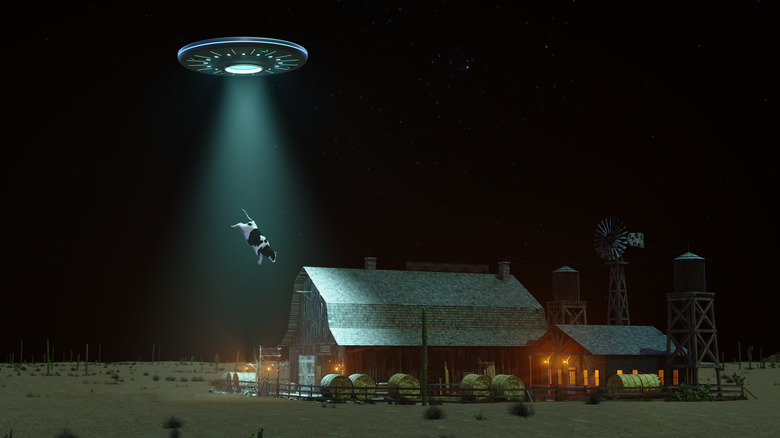 Conceptual image of a UFO abducting a cow from a farm.