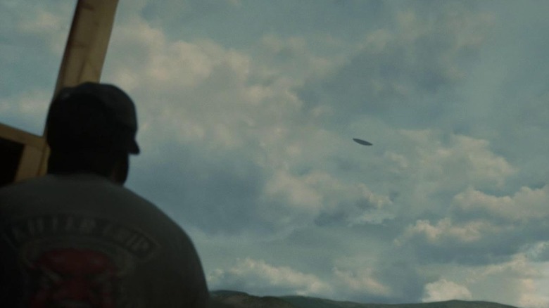 A still from Nope of Daniel Kaluuya's character looking up at a UFO.