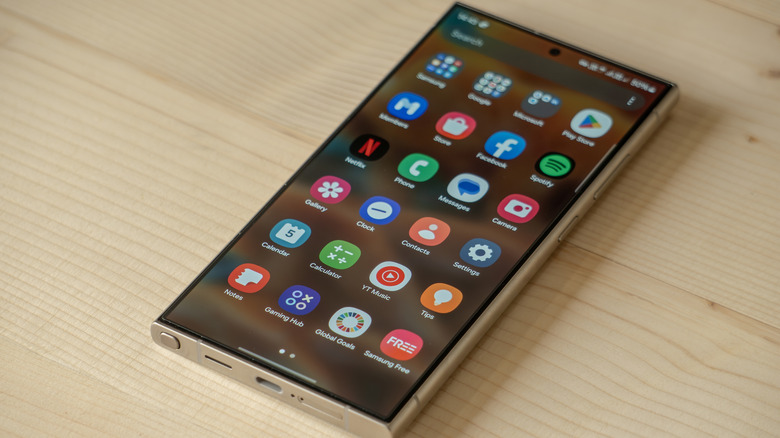 A closeup of a Samsung S24 Ultra on a table showing an app list