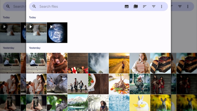 A smartphone sitting on a laptop keyboard showing the logo for the Google Play store