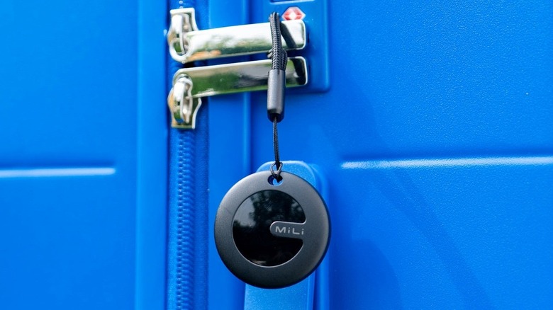 MiLi MiTag Bluetooth Tracker attached to luggage