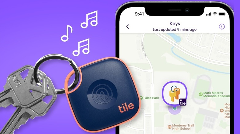 A Tile Mate attached to keys next to an iPhone