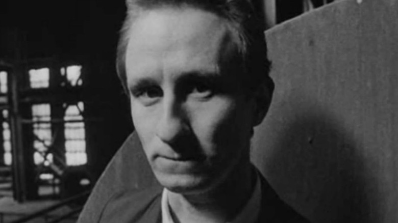 Ben (Benoît Poelvoorde) looking at the camera in Man Bites Dog