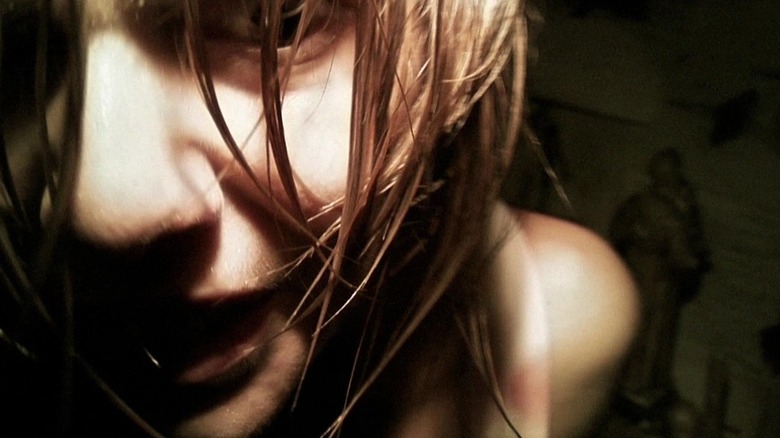 Angela (Manuela Velasco) in darkness close up to the camera in REC