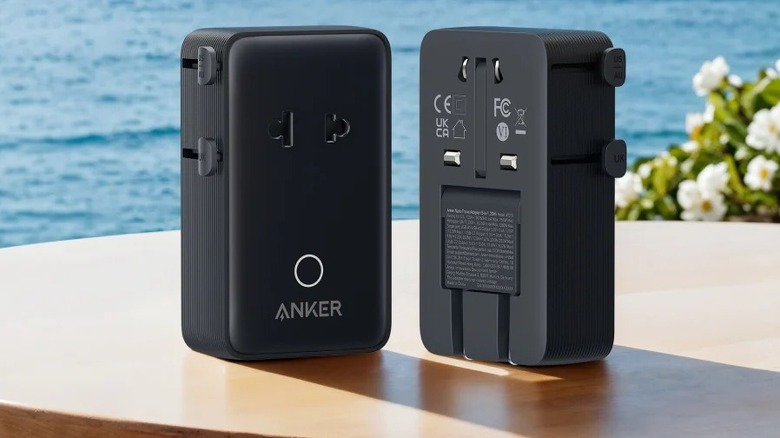 Two Anker Nano Travel Adapter units on a tablet with a water body in the background