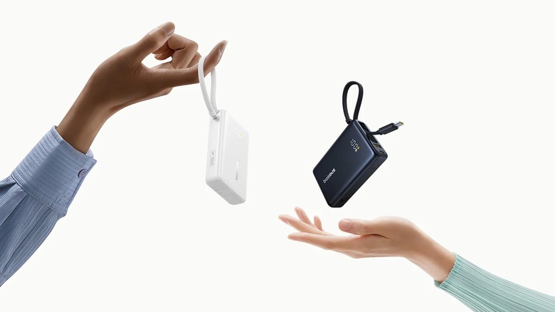 Baseus PicoGo 45W Power Bank color options being highlighted by two people against a while background