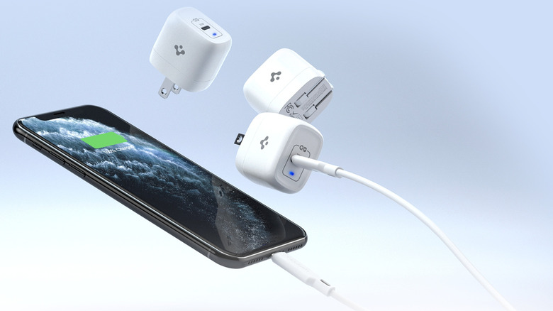 Spigen 20W ArcStation Pro connected to an iPhone with two more units in the background