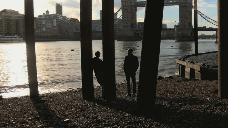 Conor and Tony standing under a bridge in "Ghost."