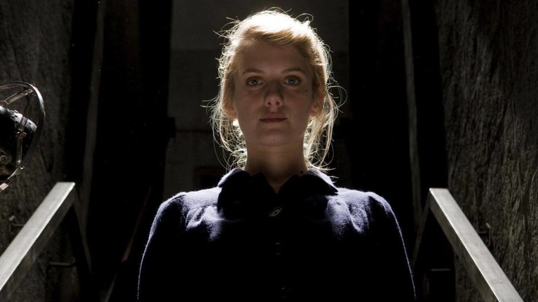Mélanie Laurent as Shoshanna walking down some stairs