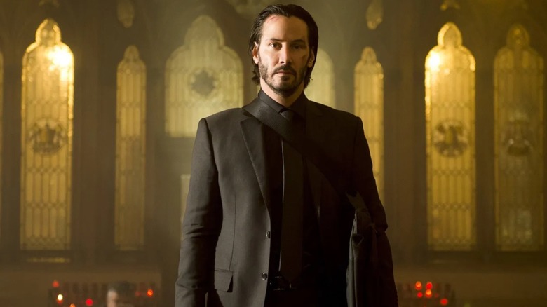 John Wick (Keanu Reeves) stood in a church in John Wick