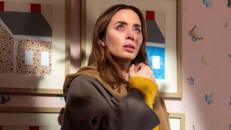 Margaret Fairchild (Emily Blunt) stood in front of a bedroom wall looking up in Disclosure Day