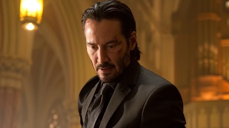 John Wick (Keanu Reeves) looking downward in 