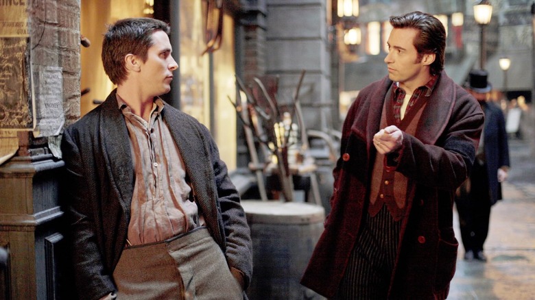 Borden (Bale) talking to Angier (Jackman) in The Prestige