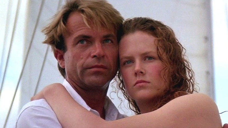 John and Rae embracing on a boat in "Dead Calm."