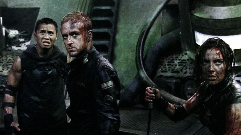 Ben Foster, Cung Le, and Antje Traue in Pandorum (2009)