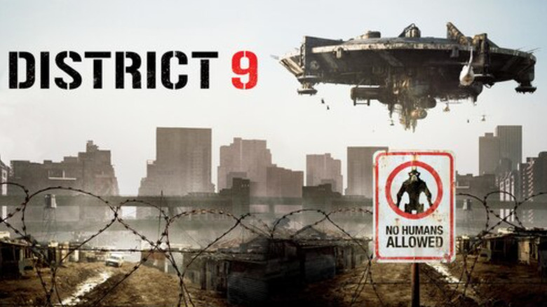 Poster image of district 9 with a ship floating above a ruined city