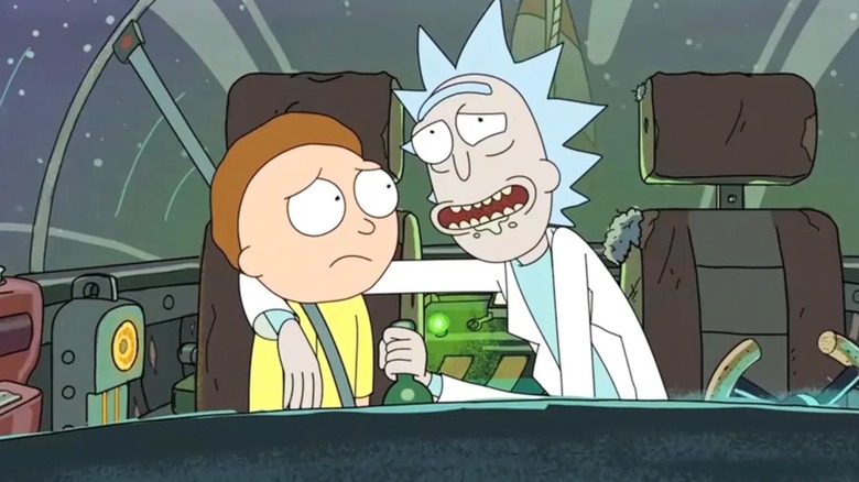 Rick hugging Morty, who looks scared, in "Rick & Morty."