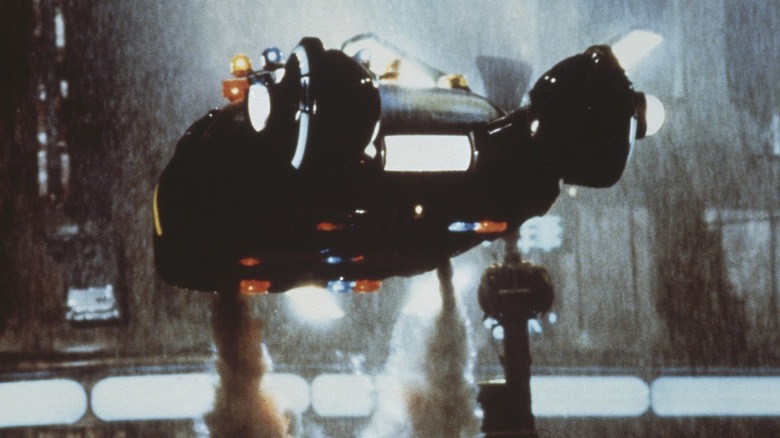 The Spinner ascending while blowing smoke in Blade Runner