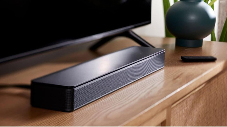 Bose TV Speaker placed on a TV console table