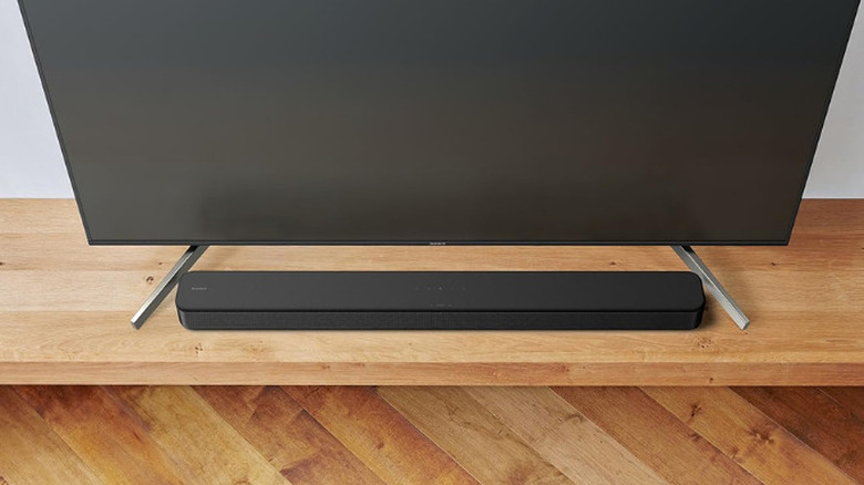 Sony S100F soundbar placed next to a TV