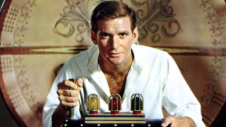Rod Taylor as H.G. Wells pulling on a lever in The Time Machine
