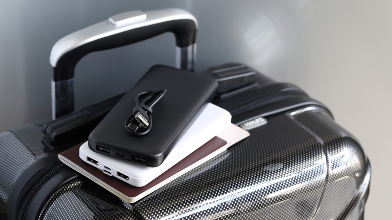 Luggage with a phone and power bank placed on top