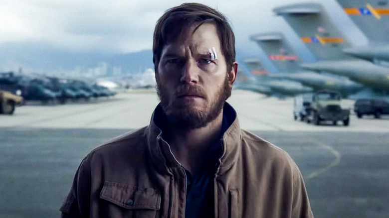 James (Chris Pratt) standing on a runway on 