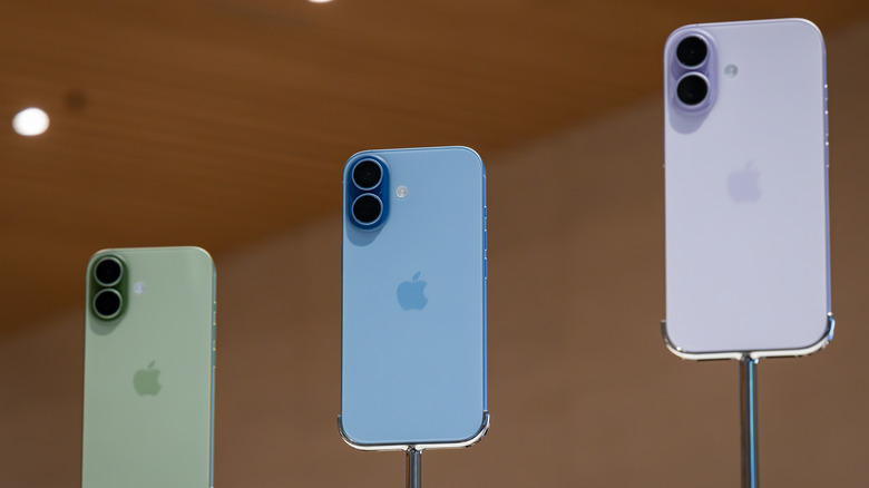 iPhone 17 models on display inside an Apple Store