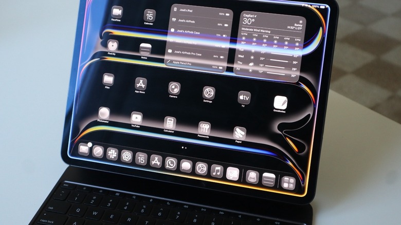 An iPad Pro on a table with a Magic Keyboard attached to it
