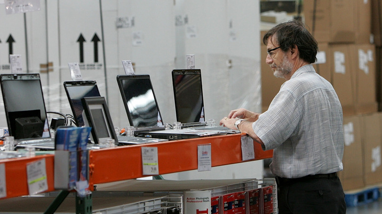 Man looking at laptops at Costco