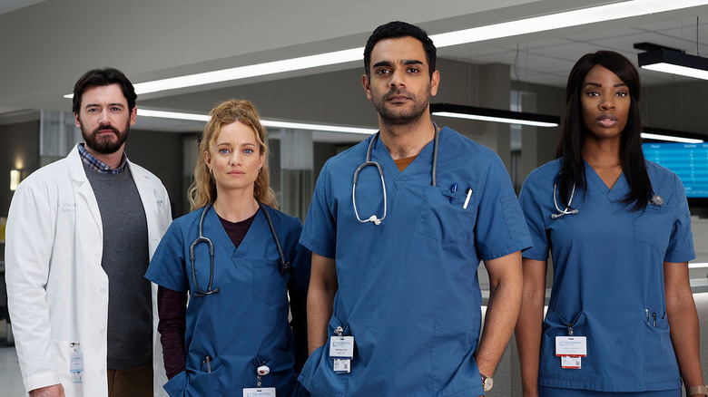The cast of the series Transplant posing.