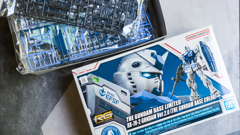 An opened Gundam plastic model box.