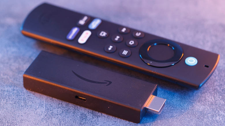 An Amazon Fire TV Stick and remote control