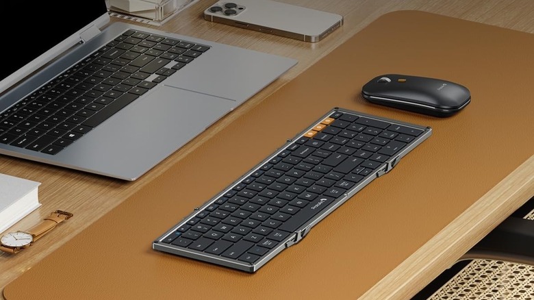 ProtoArc foldable keyboard and mouse combo XKM01 bundle on a desk with a laptop.