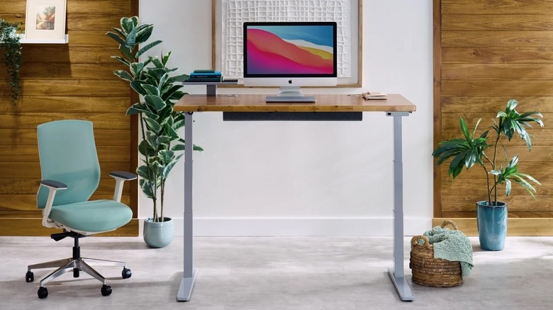 Uplift V3 standing desk with modular design for home office in raised position.