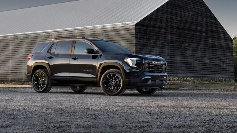 2026 GMC Terrain parked outdoors by a barn.