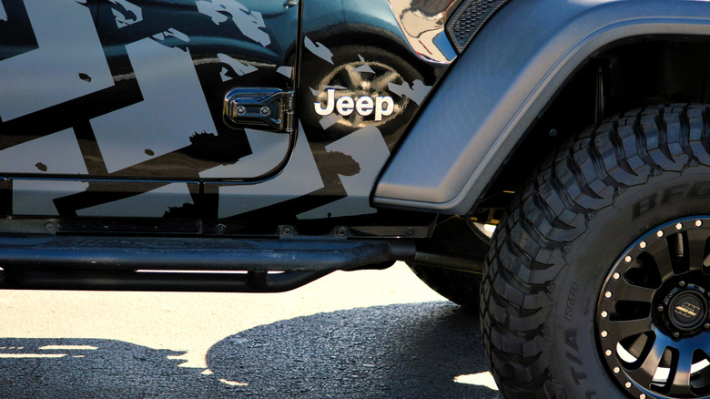 Close up of custom Jeep Wrangler exterior with logo visible.