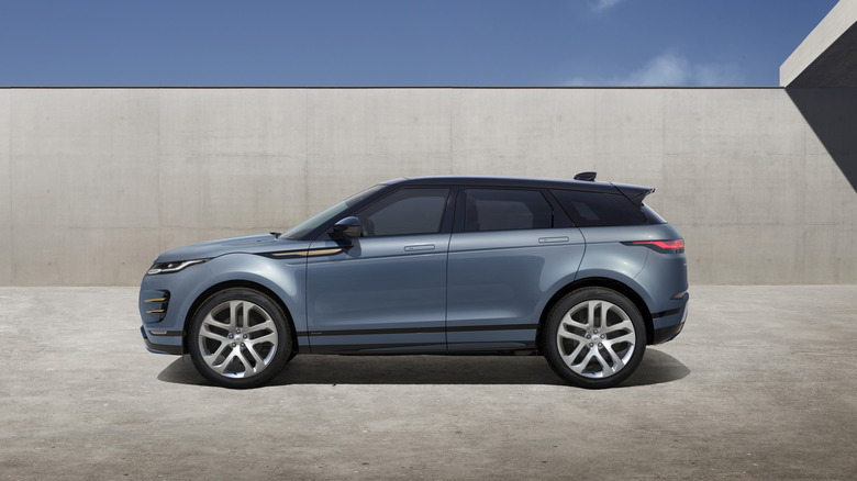 Range Rover Evoque from the side parked outside by Land Rover.