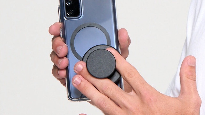A person using PopSockets MagSafe Grip with an Android phone
