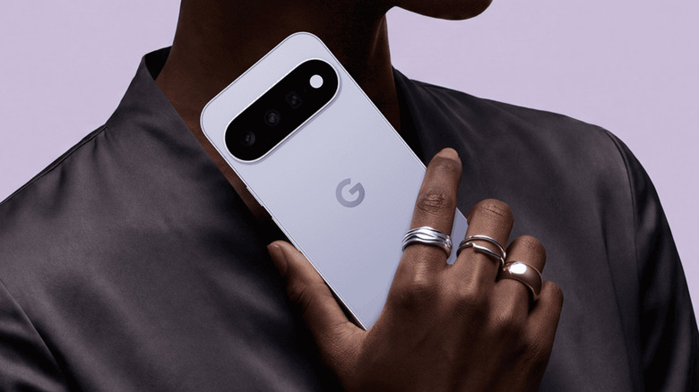 Man holding a Google Pixel 11 smartphone